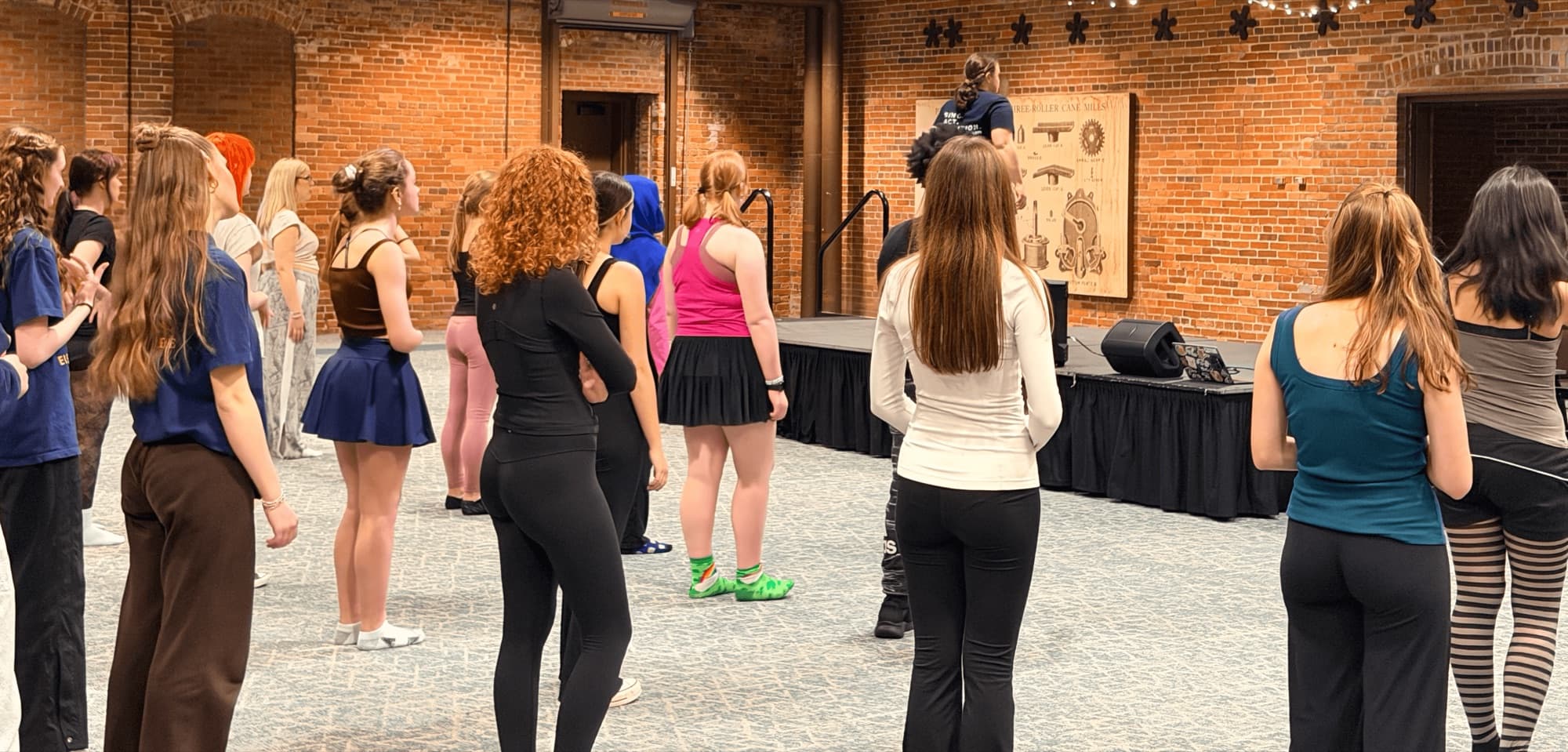 Performers on stage at an MK Performing Arts class
