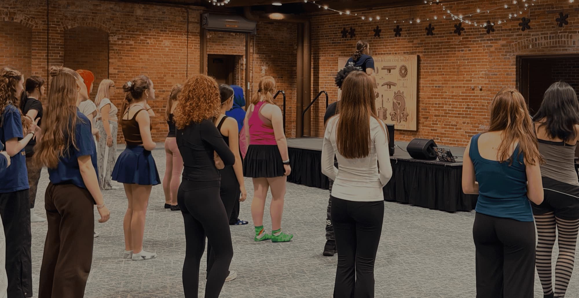 A University Prep coach working with a student on an audition piece